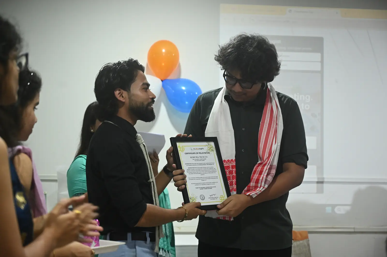 Kohuwa receiving a Certificate of Felicitation from Mr Biologist